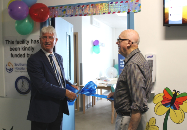 Former Southampton FC player Mike Earls cutting ribbon on new activity hub 