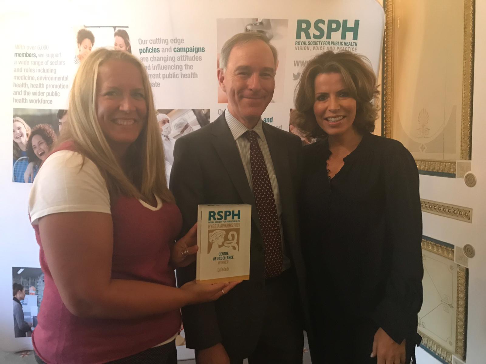 LifeLab programme leader Dr Kathryn Woods-Townsend receiving the RSPH award with co-director Professor Keith Godfrey and RSPH vice president Natasha Kaplinsky