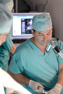 Tim Dudderidge, consultant urological surgeon, in theatre