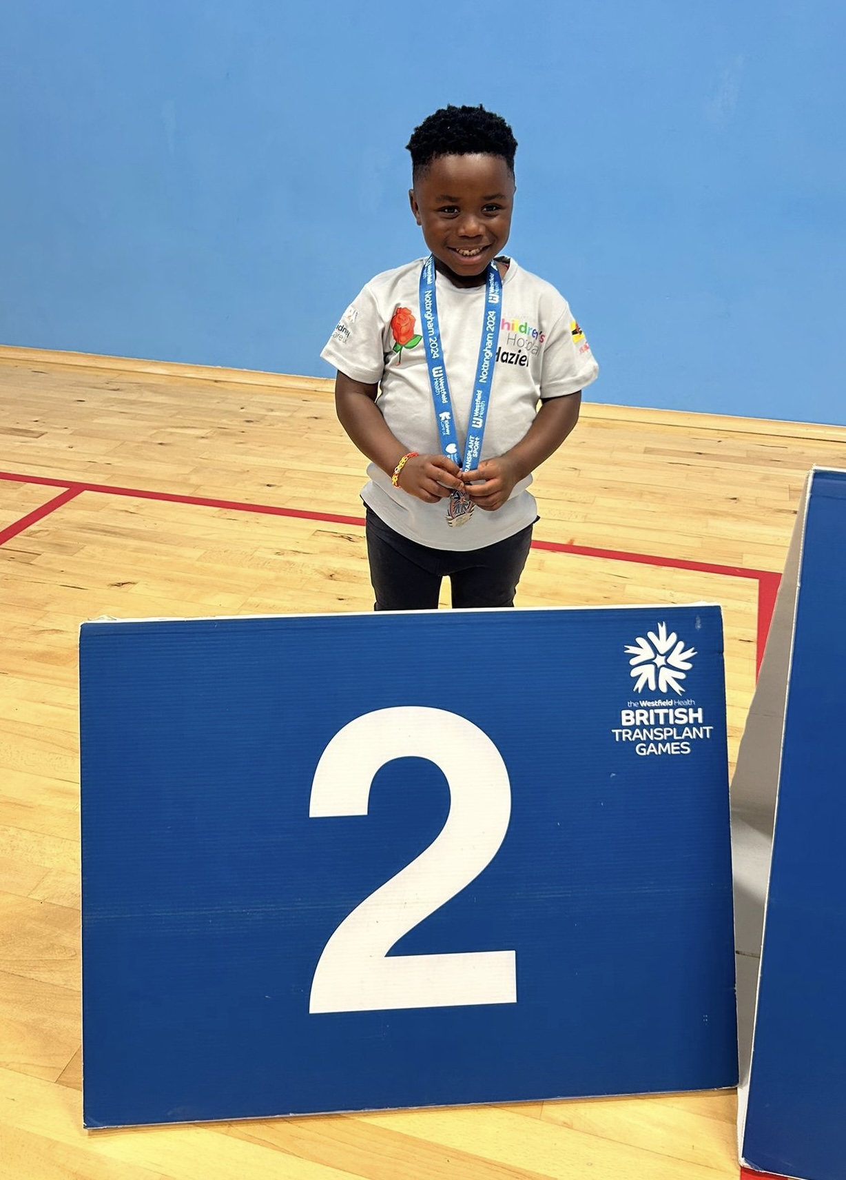 Haziel Poku on the podium with his silver medal. 