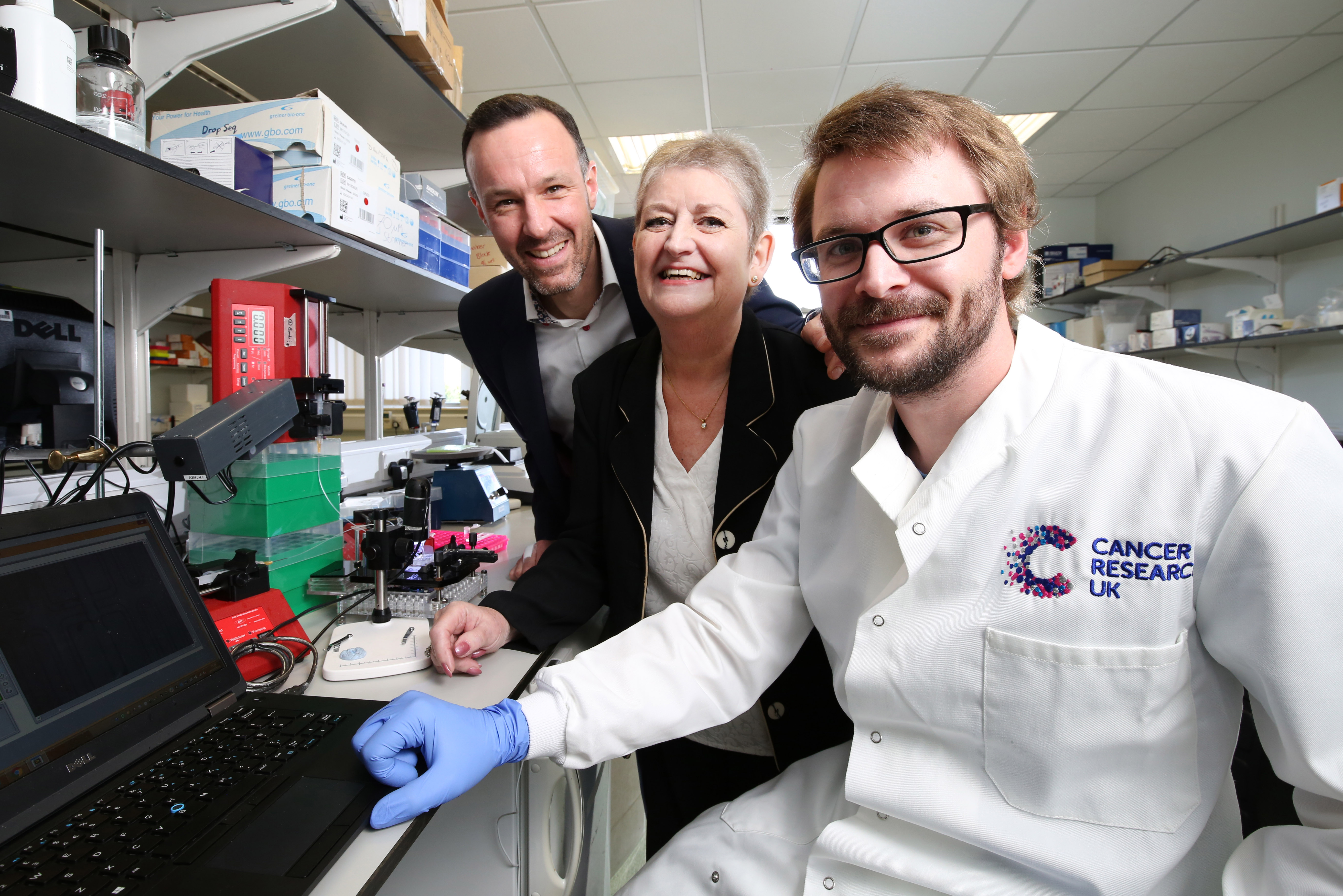 Professor Tim Underwood, Janet Jenkins and scientist from Cancer Research UK