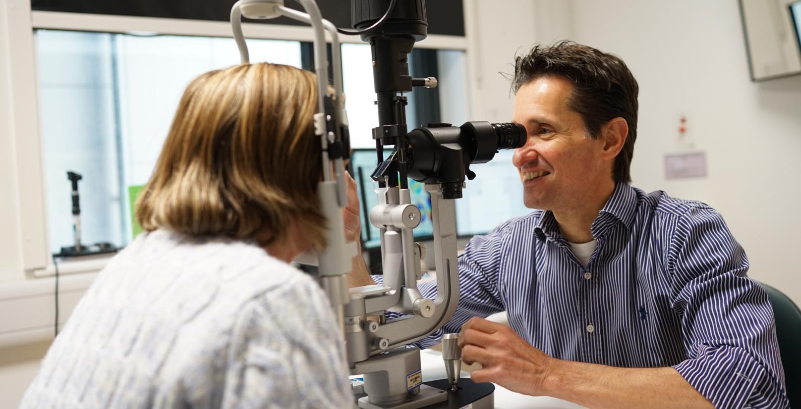 A patient having her eye examined