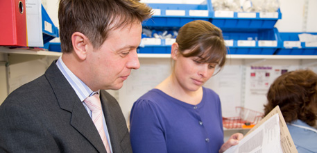Two members of the rheumatolgy team looking at a file.
