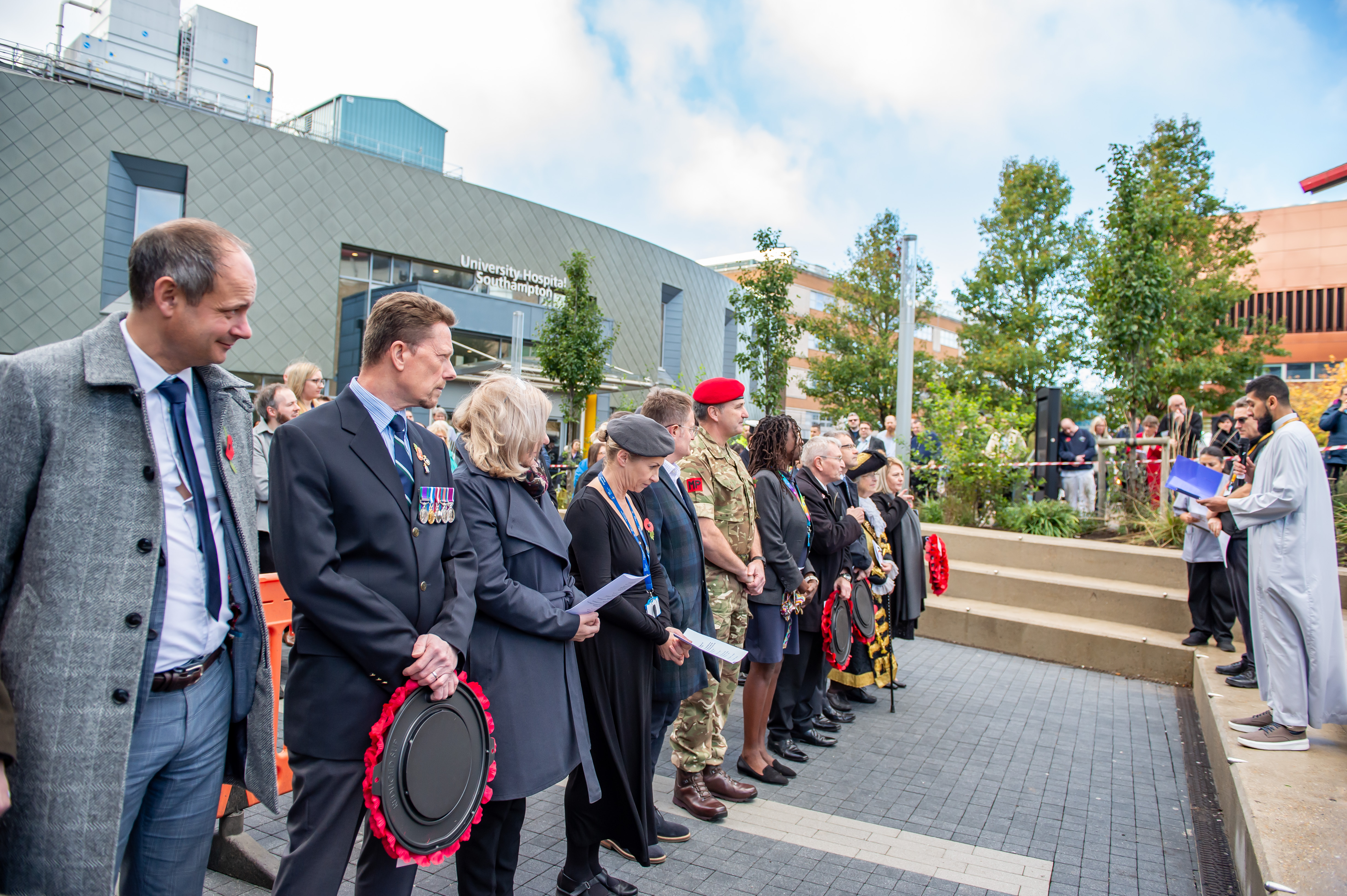 People stood listening at a Remembrance Day event