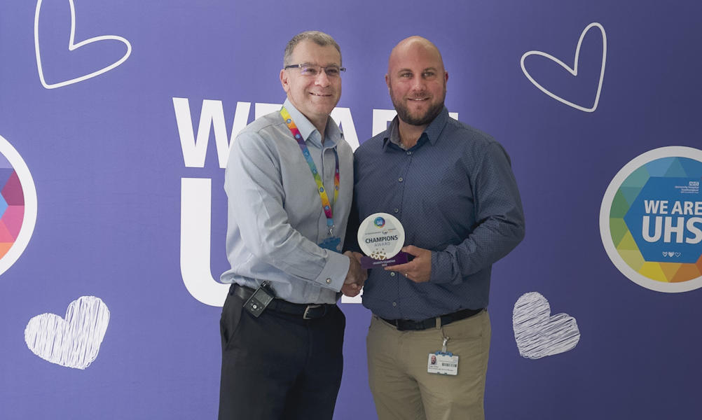 Craig Hobbs standing with CEO David French