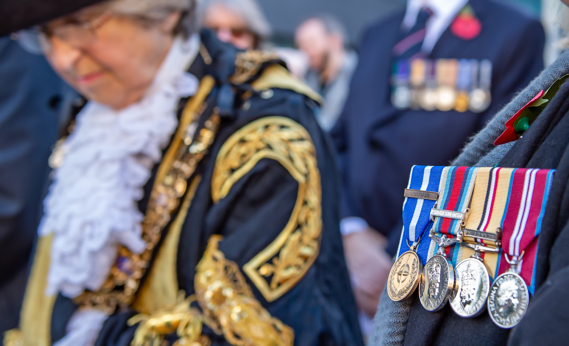 A picture of the Major with a close up of someone's medals.