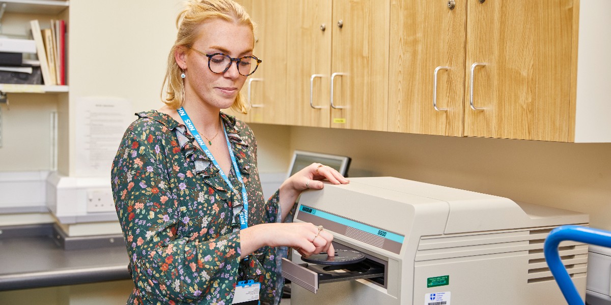 Jade working at UHS in a healthcare science role